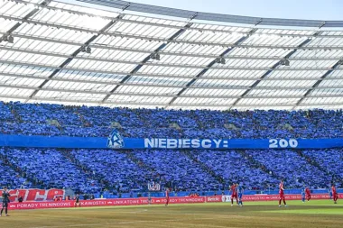 Grafika promocyjna wydarzenia Ruch Chorzów - Wisła Kraków w Betclic 1 Lidze. #MeczMistrzów na Stadionie Śląskim